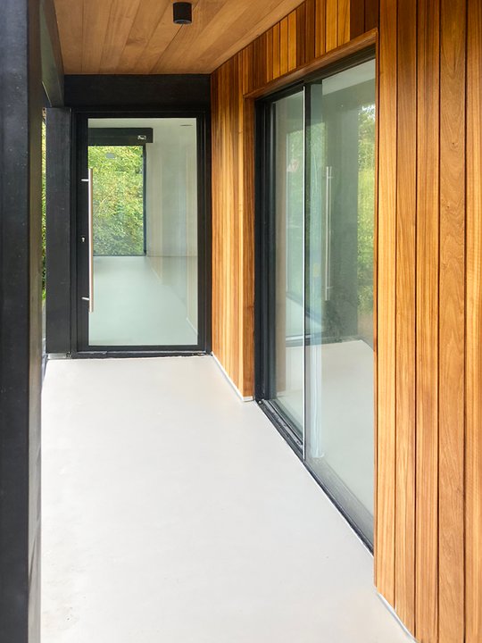 Pivot Line doors in a timber-clad interior