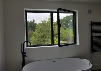 Tilt and turn window turned open in a bathroom