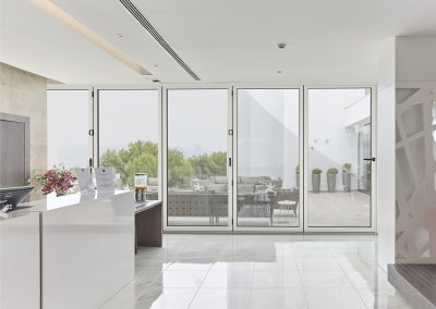 Aluminium bifold doors closed, white interior